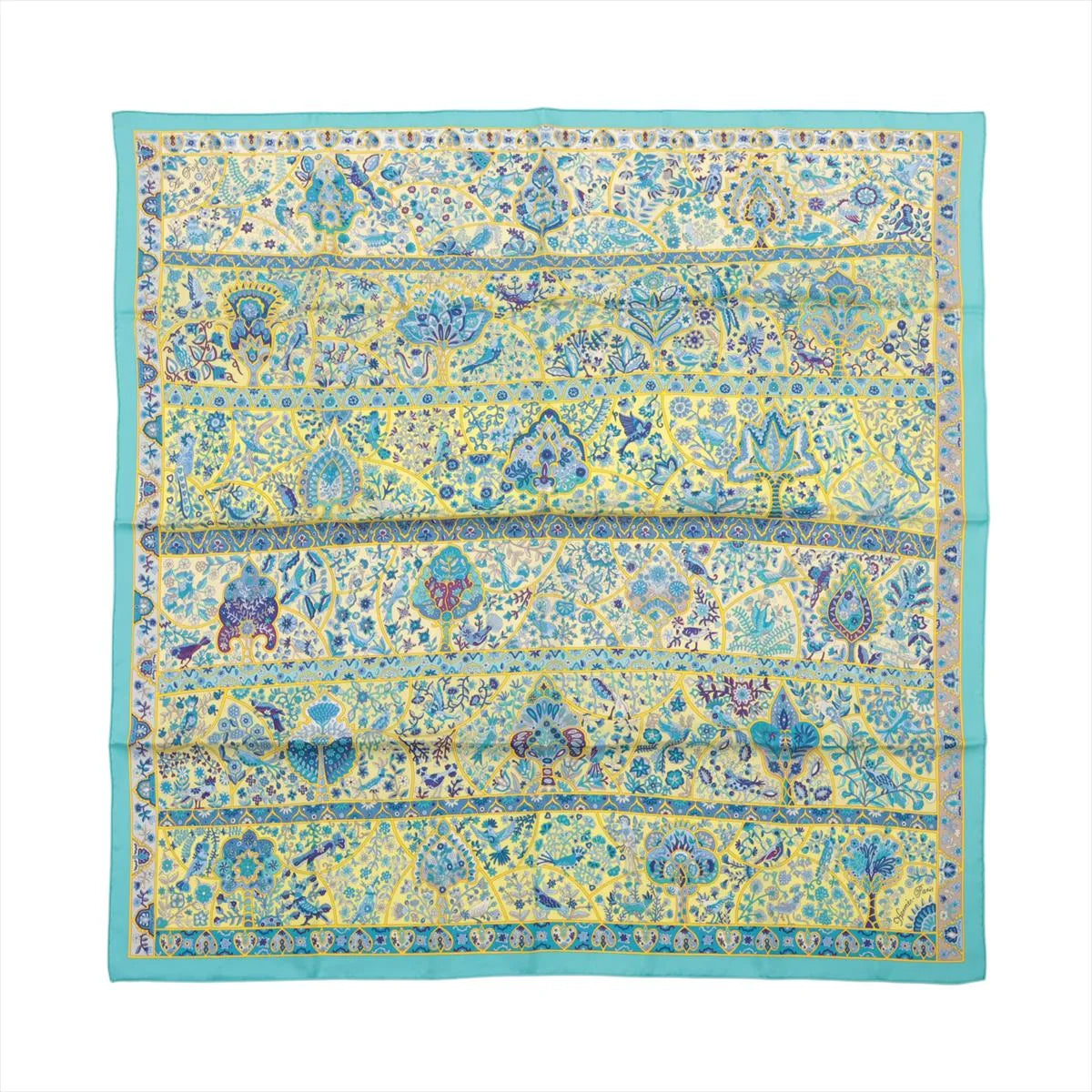 Flat view of a square Hermès Carré 90 silk scarf with a turquoise border and yellow field filled with blue floral, bird and botanical motifs.