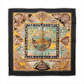 Hermès Carré 90 "Au Son du Tam Tam" silk handkerchief in black, featuring a vibrant tribal-inspired design with drums, musical instruments, and a central tree motif in yellow, turquoise, and earthy tones, bordered with geometric and symbolic patterns.