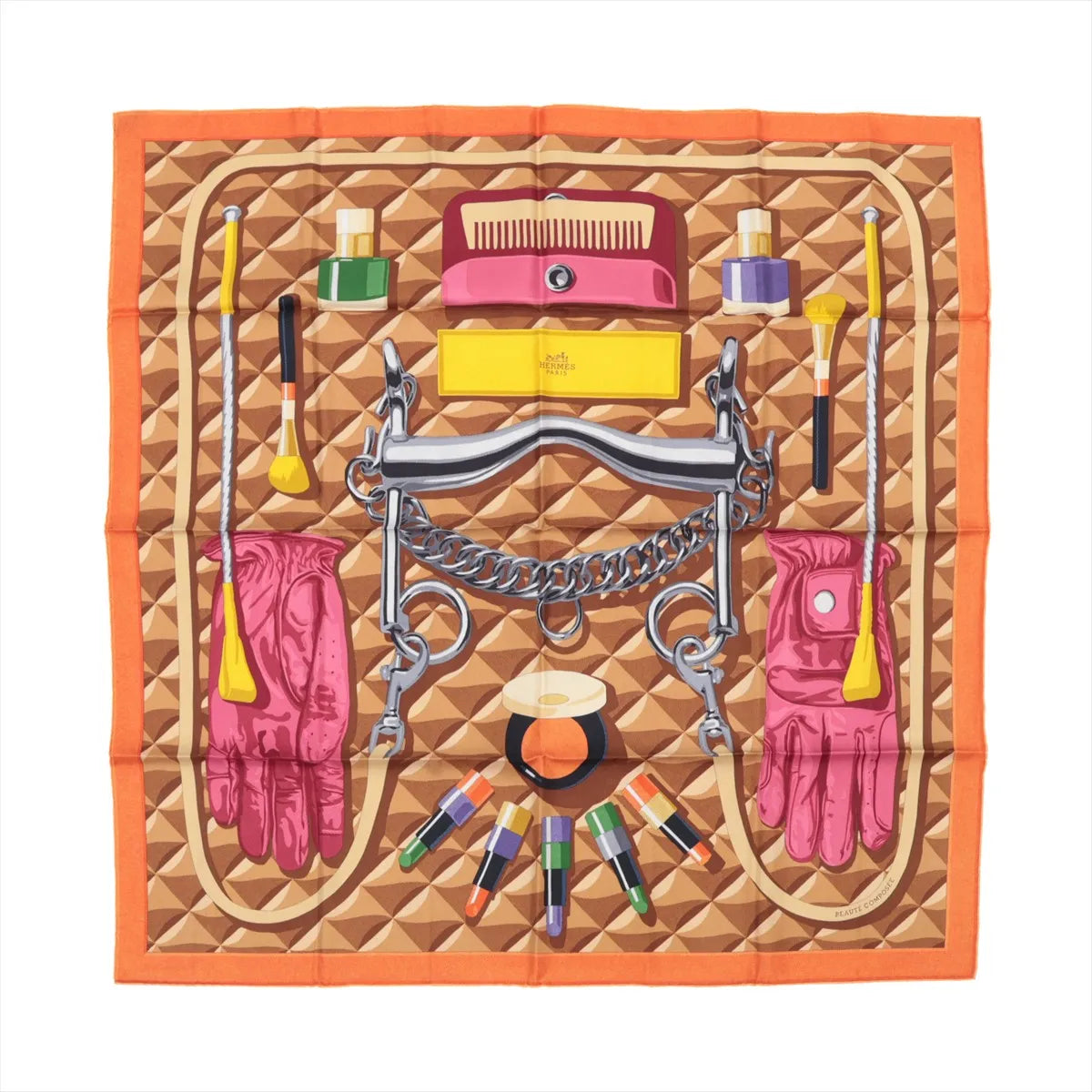 Hermès Carré 90 silk scarf titled "Beauté Composée," featuring an orange border with a central design of beauty products, pink gloves, makeup brushes, lipstick, a comb, and equestrian tack on a 3D-effect tan geometric background.