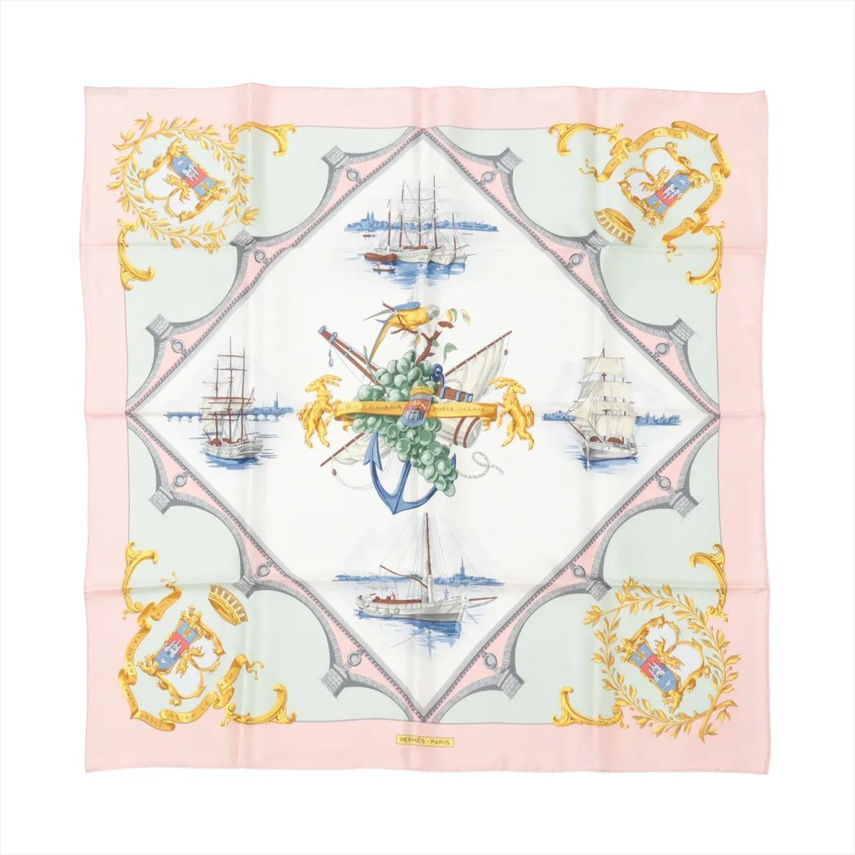 Hermès Carré 90 pink silk scarf with nautical sailing ships and central anchor motif, framed by mint green panels and gold crest details.