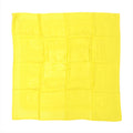 Yellow Hermès Carré 90 silk scarf laid flat with tonal jacquard pattern and subtle border, shown folded in a square grid on white background.