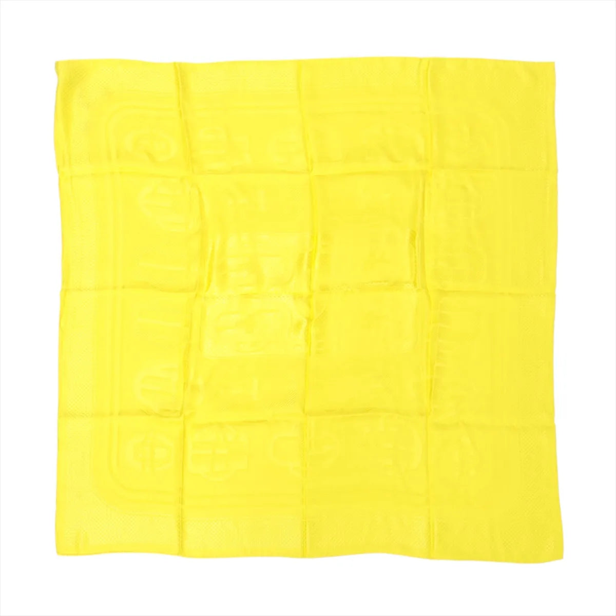 Yellow Hermès Carré 90 silk scarf laid flat with tonal jacquard pattern and subtle border, shown folded in a square grid on white background.