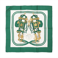Hermès Carré 90 "BRIDES de GALA" silk handkerchief in green, showcasing a symmetrical design of two ornate gold and green bridles with intricate detailing, centered on a white background with green borders, printed on luxurious silk.