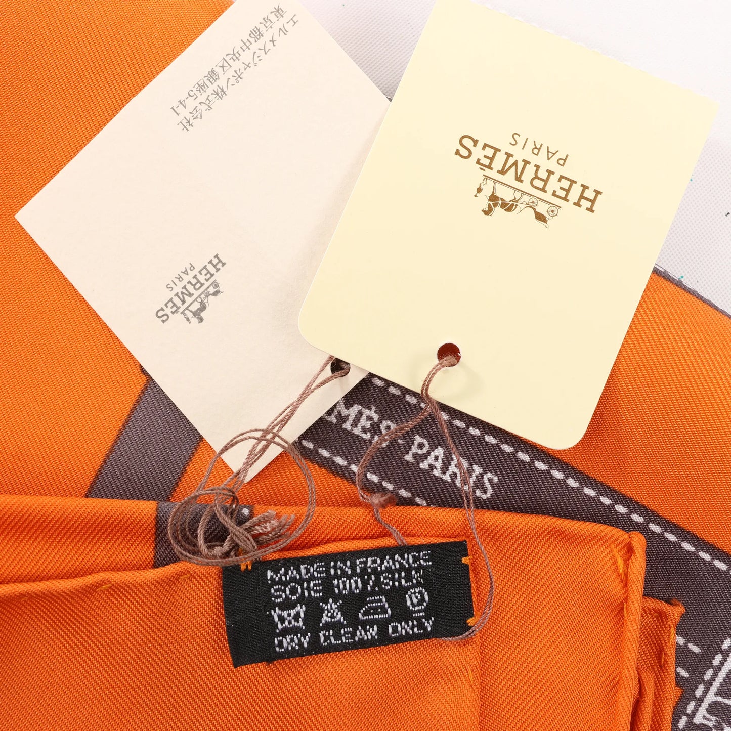 Hermès Carré 90 "Bolduc Ribbon" Silk handkerchief in Orange