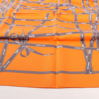 Hermès Carré 90 "Bolduc Ribbon" Pañuelo de seda en naranja
