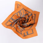 Hermès Carré 90 "Bolduc Ribbon" Silk handkerchief in Orange
