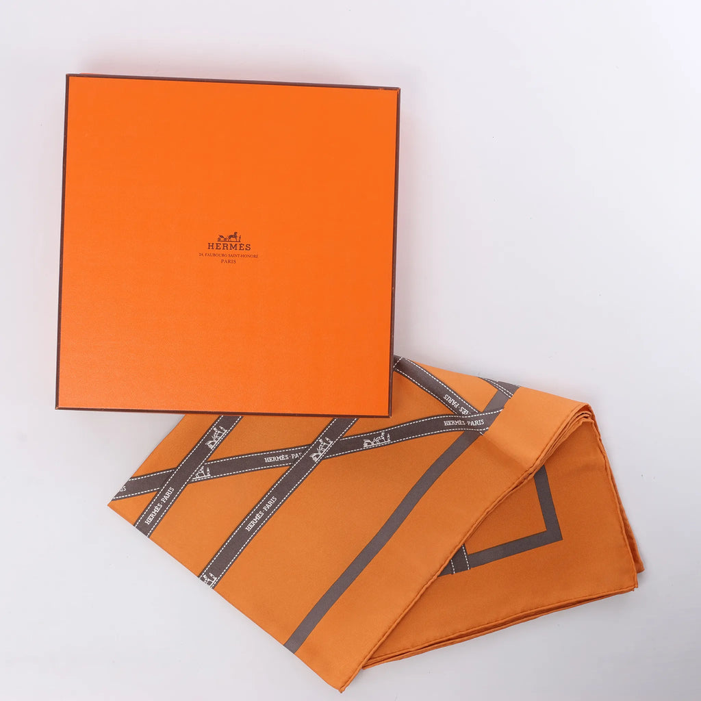 Hermès Carré 90 "Bolduc Ribbon" Silk handkerchief in Orange