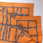 Hermès Carré 90 "Bolduc Ribbon" Silk handkerchief in Orange