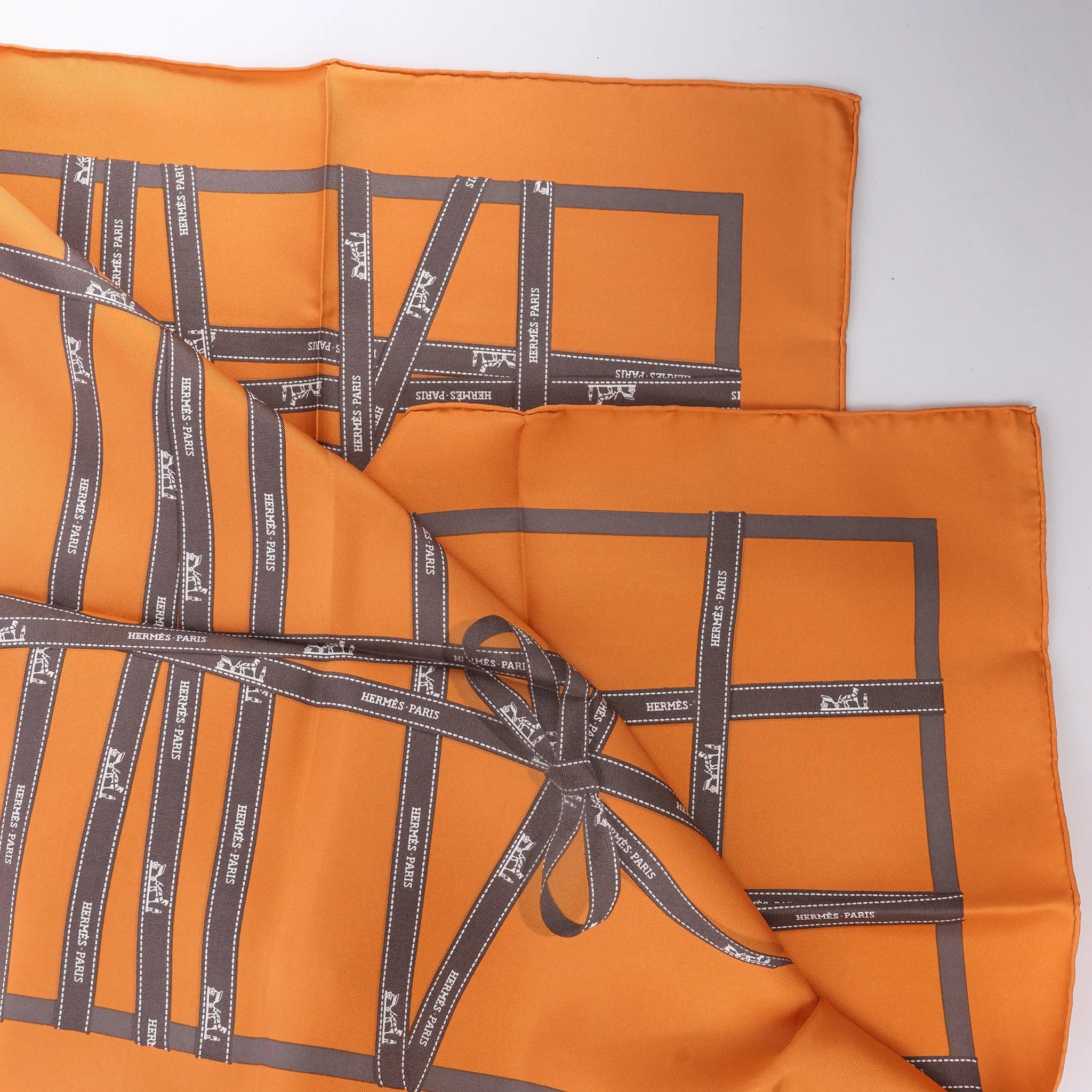 Hermès Carré 90 "Bolduc Ribbon" Silk handkerchief in Orange