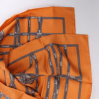 Hermès Carré 90 "Bolduc Ribbon" Silk handkerchief in Orange