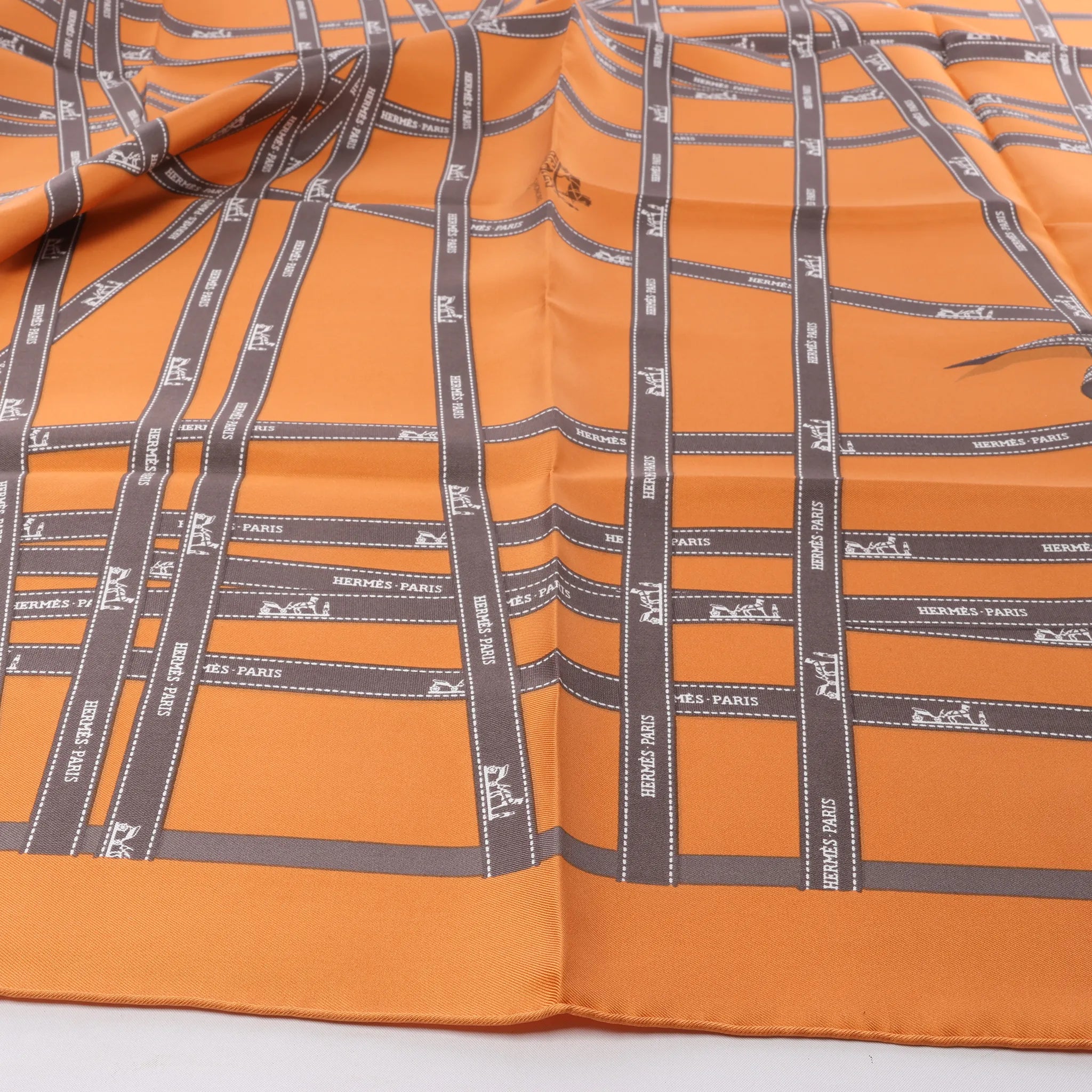 Hermès Carré 90 "Bolduc Ribbon" Silk handkerchief in Orange