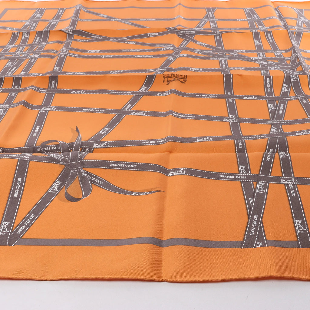 Hermès Carré 90 "Bolduc Ribbon" Silk handkerchief in Orange