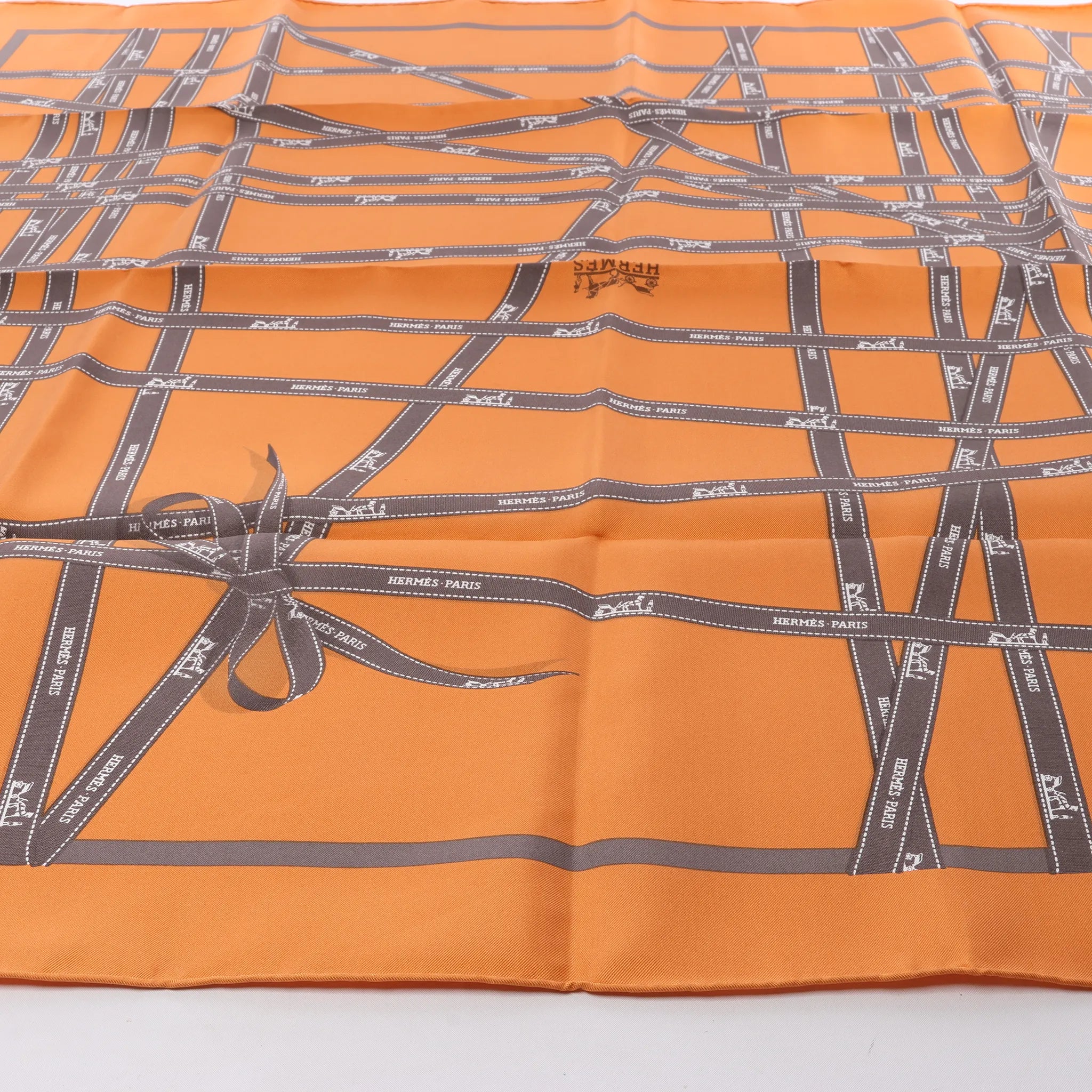 Hermès Carré 90 "Bolduc Ribbon" Silk handkerchief in Orange