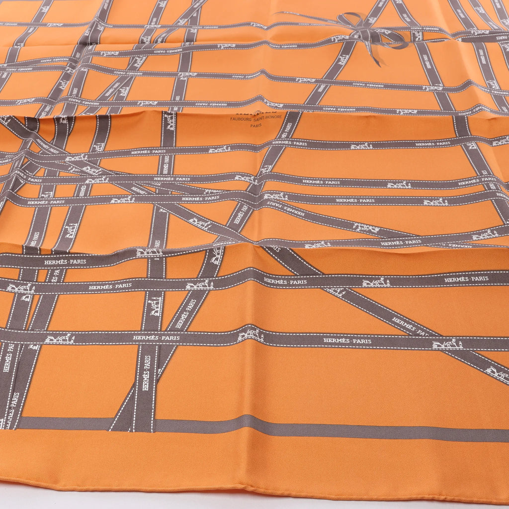 Hermès Carré 90 "Bolduc Ribbon" Silk handkerchief in Orange