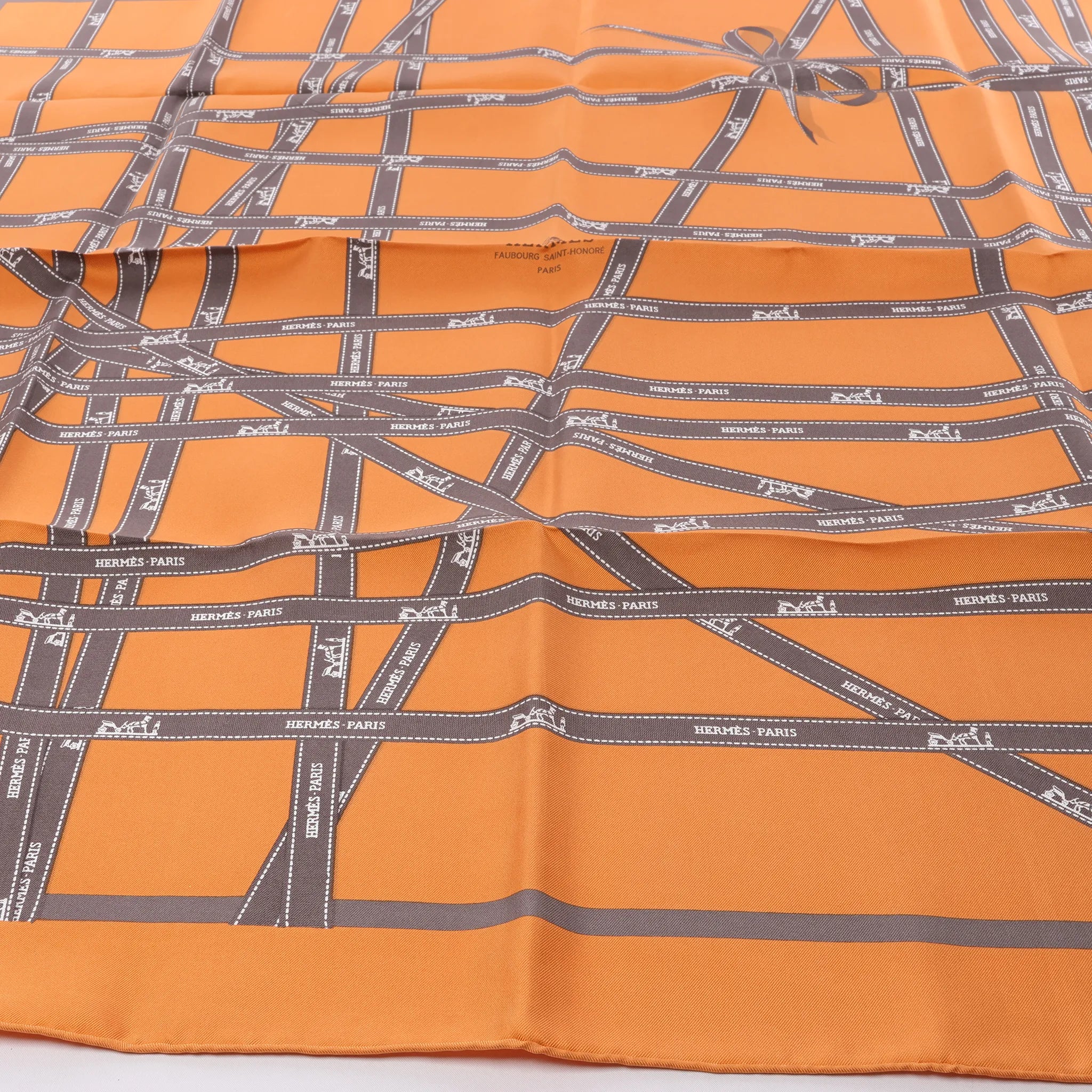 Hermès Carré 90 "Bolduc Ribbon" Silk handkerchief in Orange