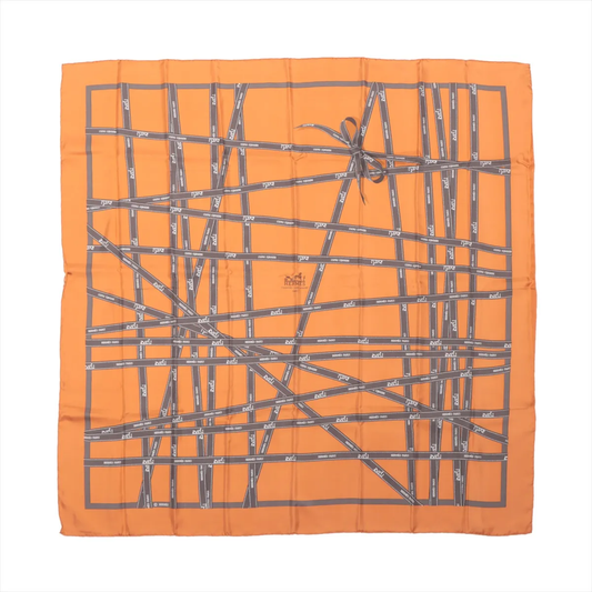 Hermès Carré 90 “Bolduc Ribbon” Silk Scarf in orange featuring gray ribbon pattern with Hermès Paris logos, square shape, and neatly bordered edges, displayed flat on a white background.