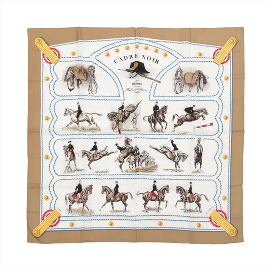 Hermès Carré 90 "CADRE NOIR" silk scarf in beige featuring detailed equestrian illustrations of riders and horses in motion, surrounded by military-inspired trims and blue stitched borders.
