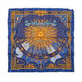 Hermès Carré 90 "CARPE DIEM" silk scarf in vibrant blue, featuring a radiant golden sun with a face at the center, surrounded by zodiac and celestial motifs, stars, moons, and Roman numerals on a detailed border.