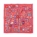 Hermès Carré 90 red silk scarf with allover geometric buckle and strap illustrations in pink, purple, blue, and white, framed by a pink border.
