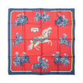 Hermès Carré 90 Carrousel silk scarf in red with a navy border, central white horse and blue ceremonial riders.