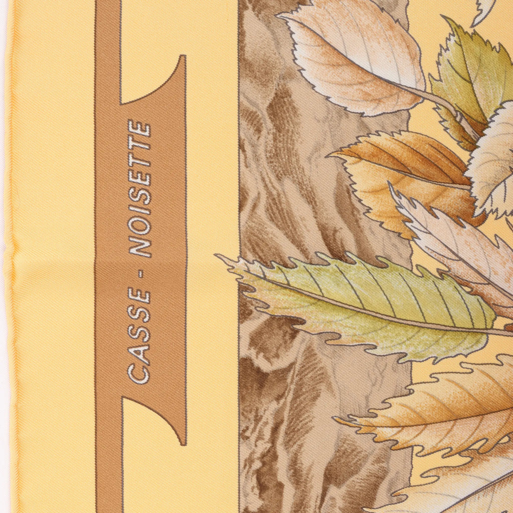 Hermès Carré 90 "CASSE NOISETTE" Silk handkerchief in Yellow x Brown