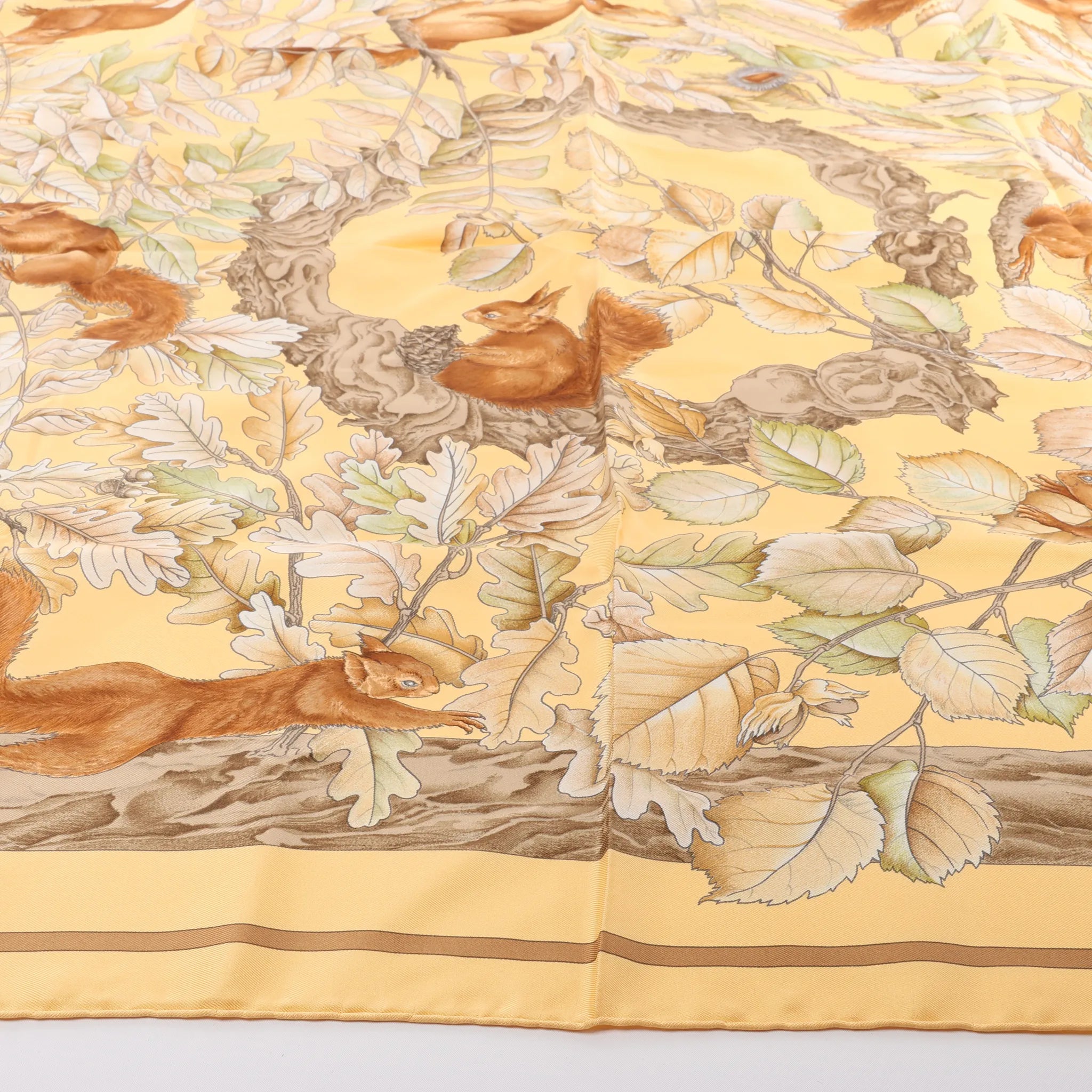 Hermès Carré 90 "CASSE NOISETTE" Silk handkerchief in Yellow x Brown