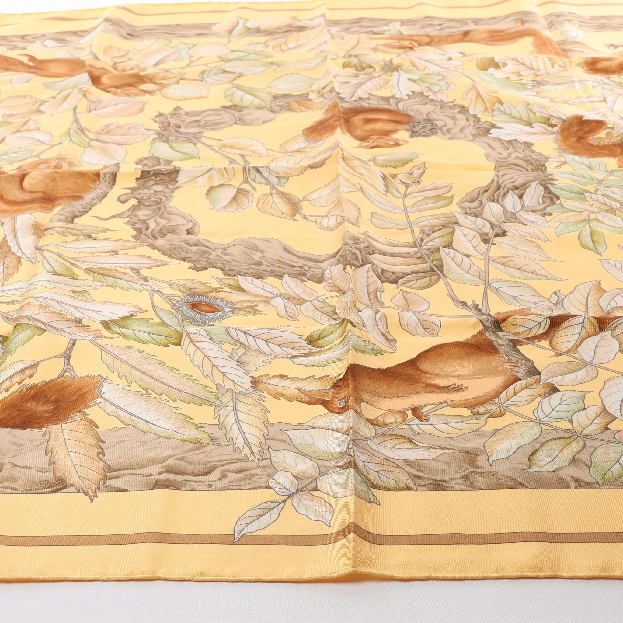 Hermès Carré 90 "CASSE NOISETTE" Silk handkerchief in Yellow x Brown