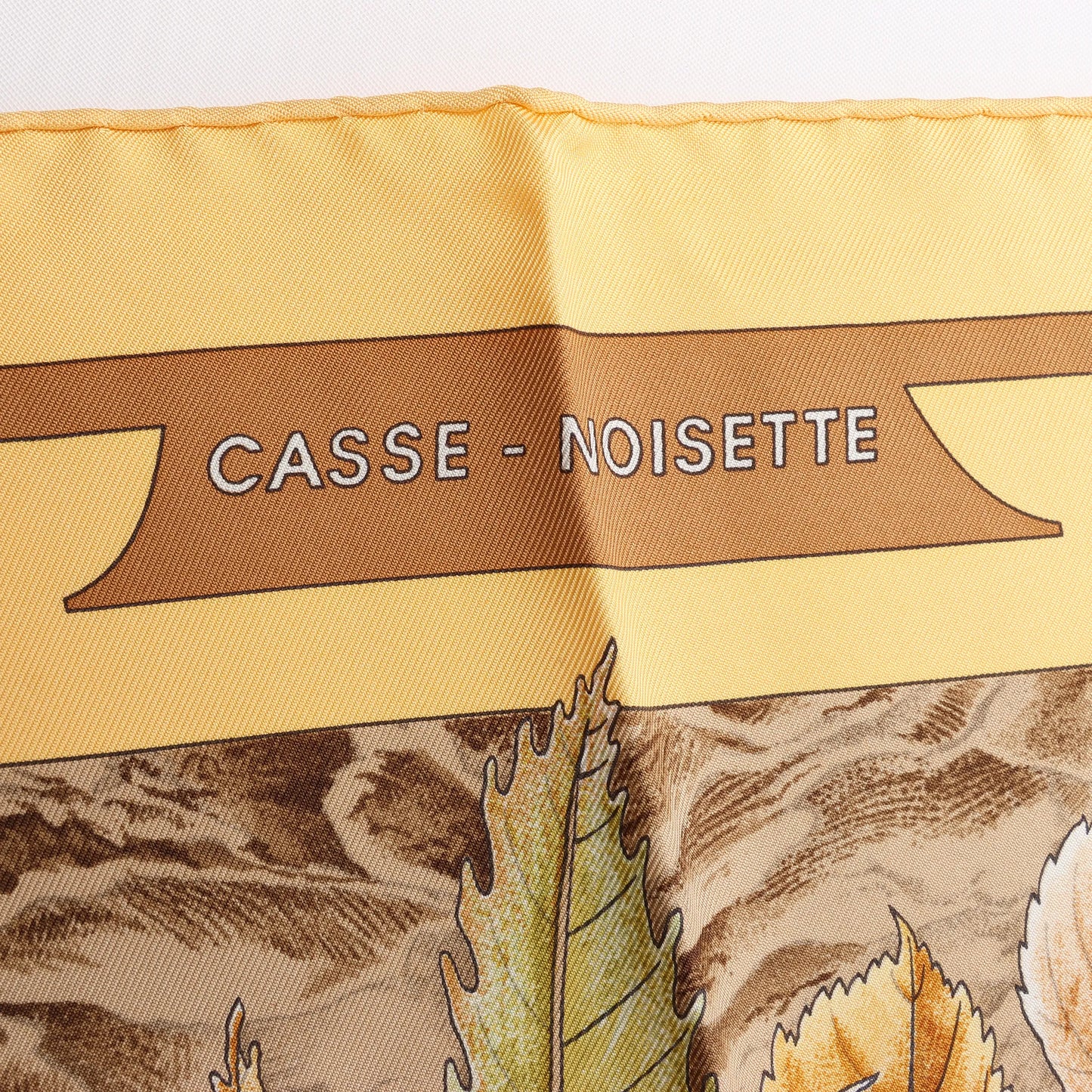 Hermès Carré 90 "CASSE NOISETTE" Silk handkerchief in Yellow