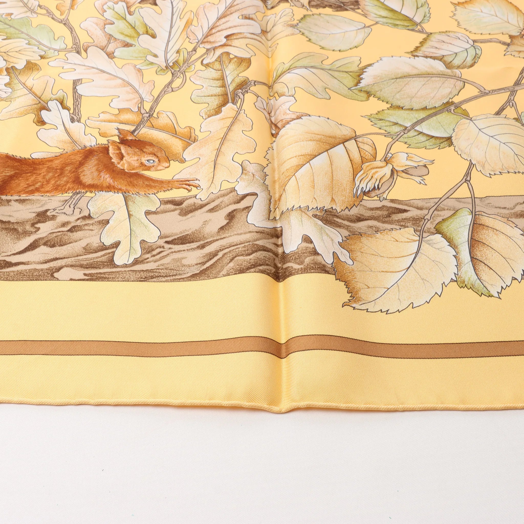 Hermès Carré 90 "CASSE NOISETTE" Silk handkerchief in Yellow