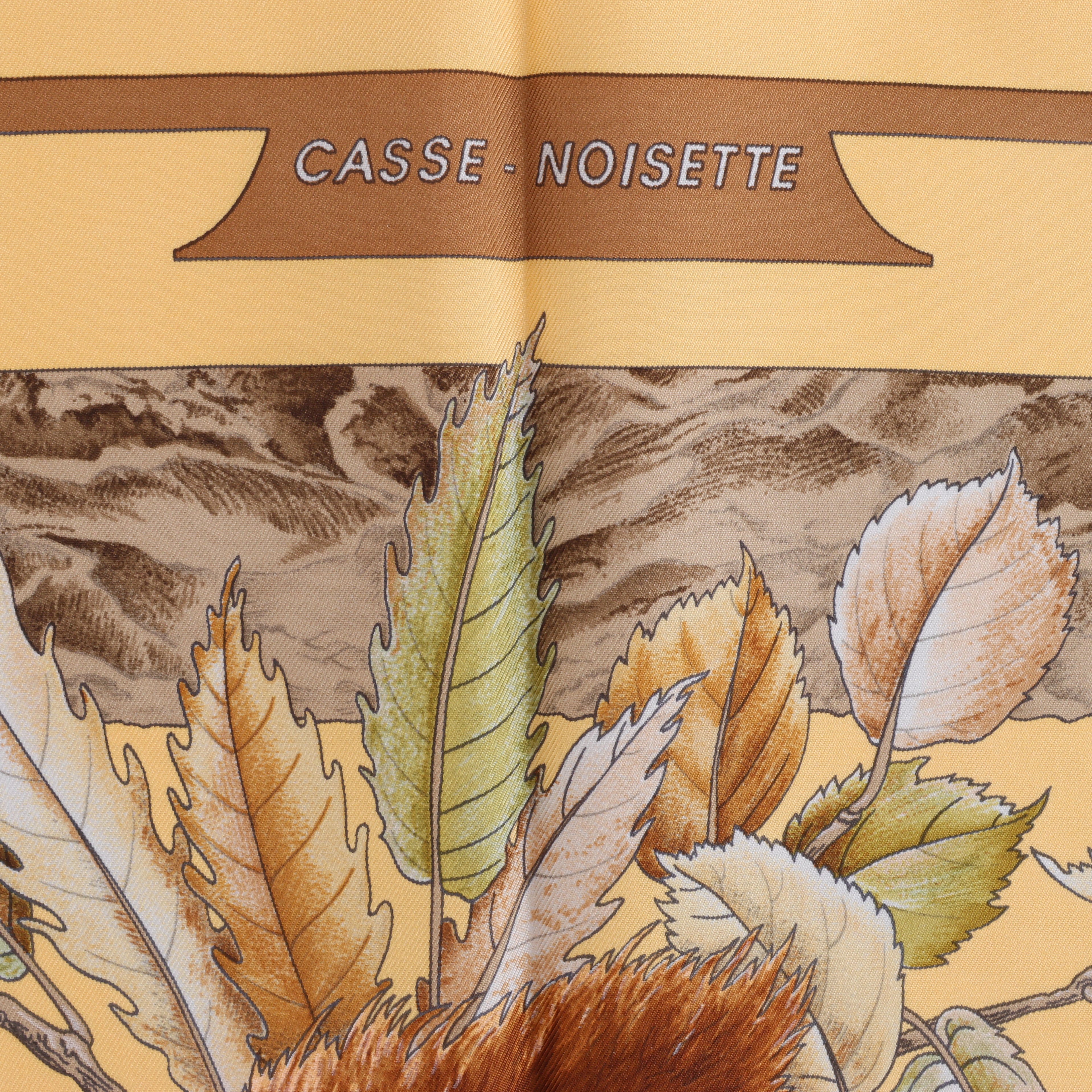 Hermès Carré 90 "CASSE NOISETTE" Silk handkerchief in Yellow