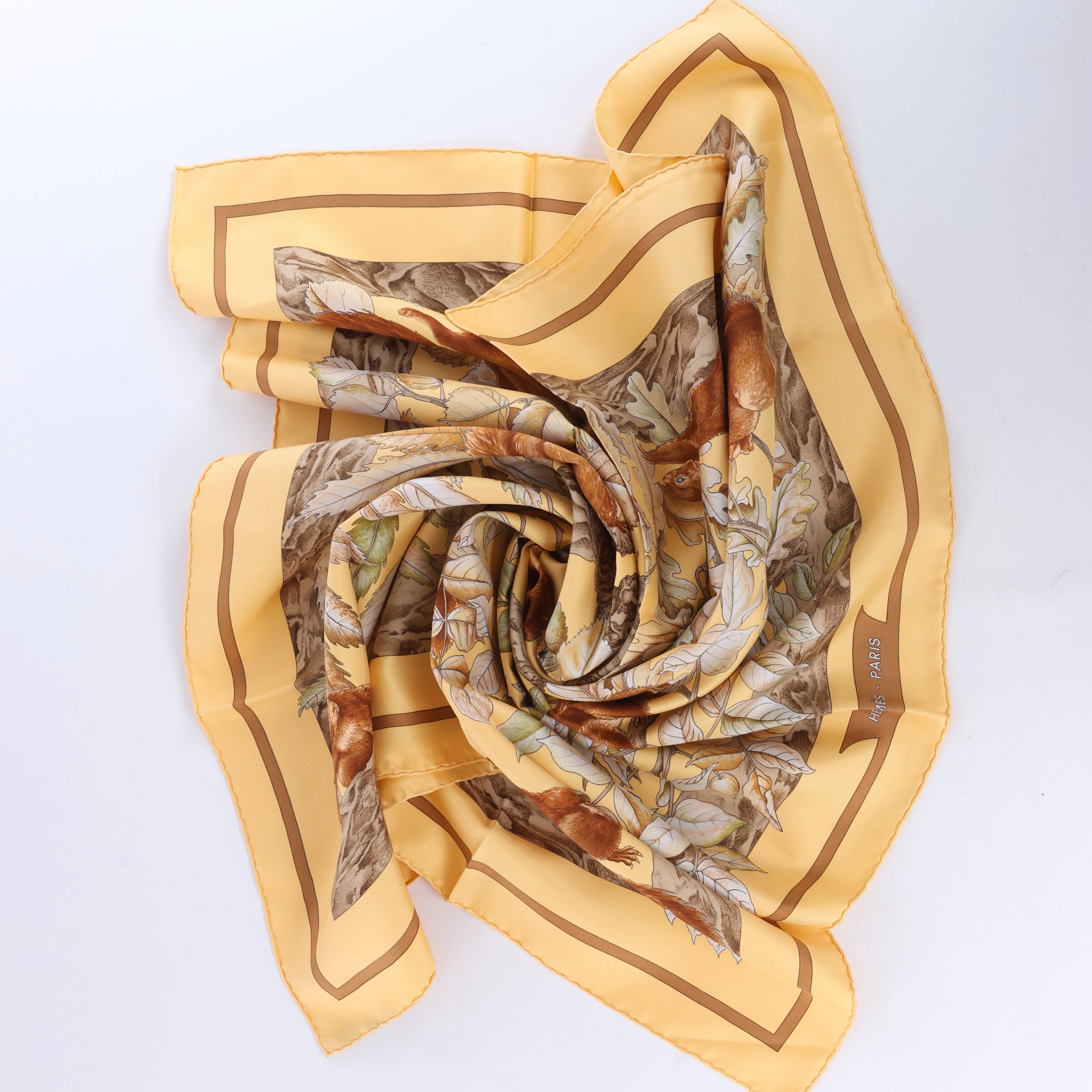 Hermès Carré 90 "CASSE NOISETTE" Silk handkerchief in Yellow
