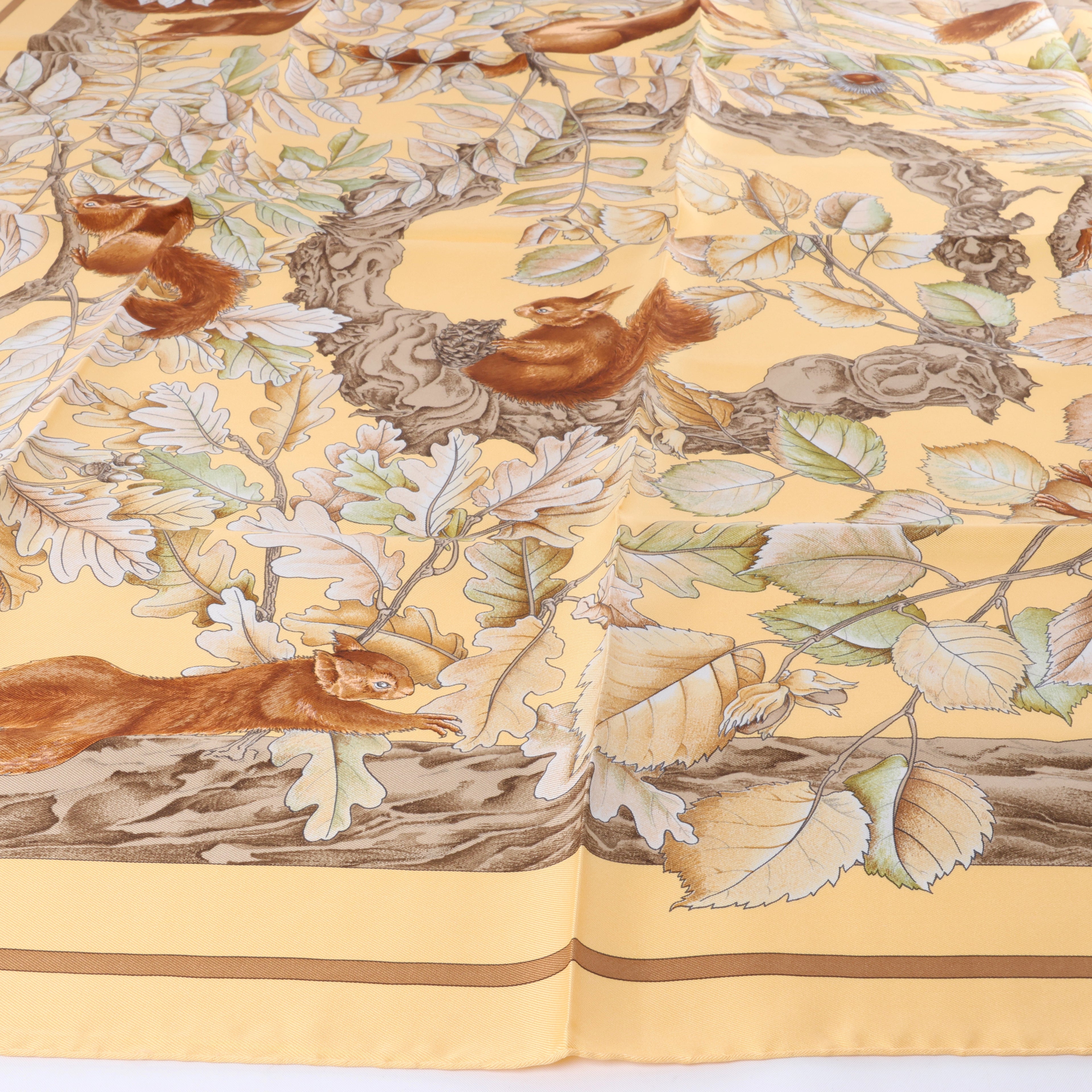 Hermès Carré 90 "CASSE NOISETTE" Silk handkerchief in Yellow