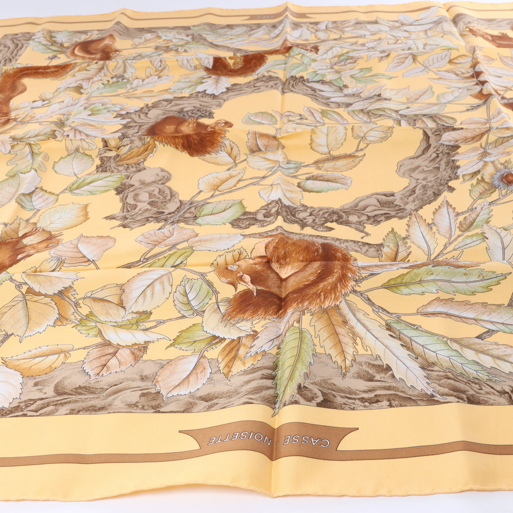 Hermès Carré 90 "CASSE NOISETTE" Silk handkerchief in Yellow