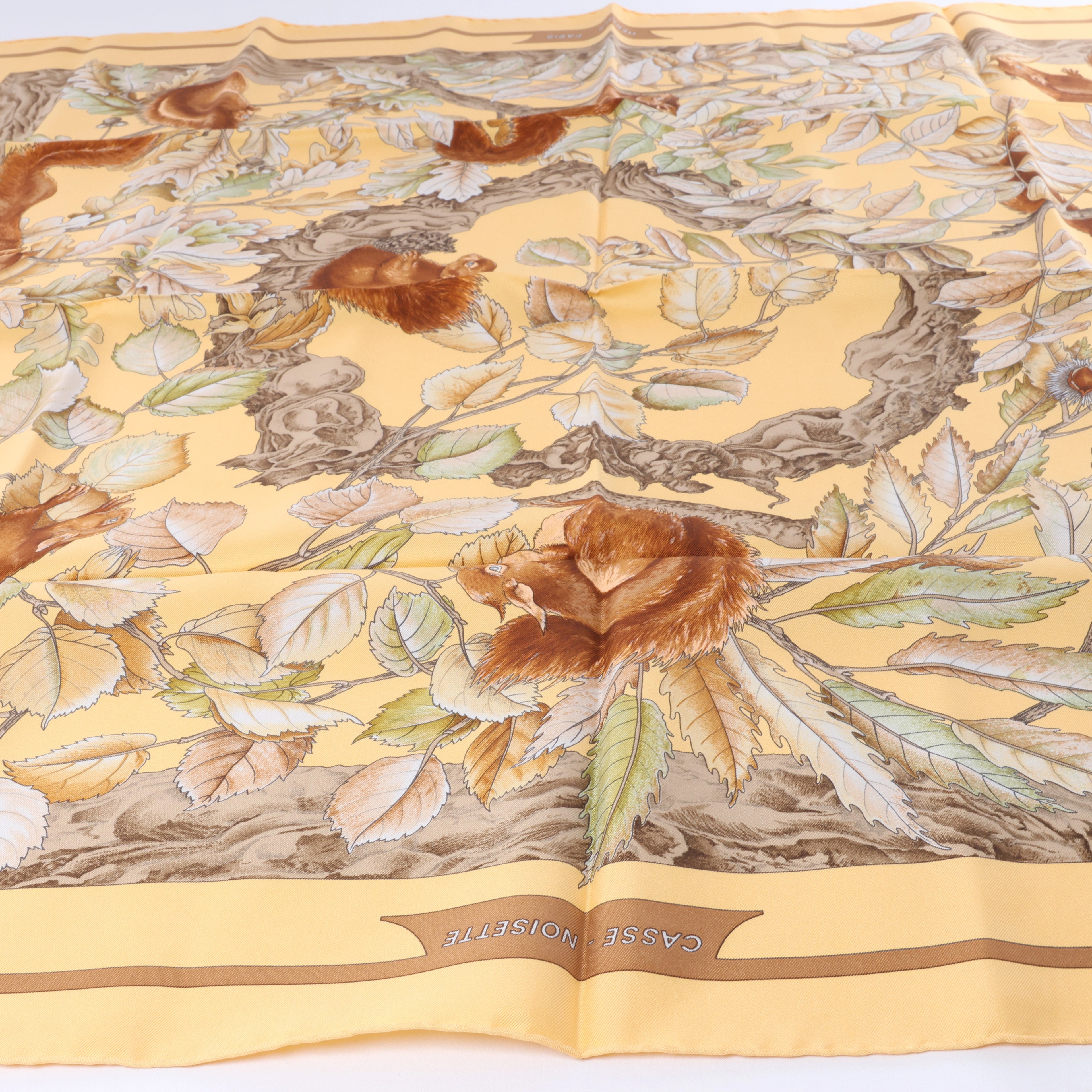 Hermès Carré 90 "CASSE NOISETTE" Silk handkerchief in Yellow