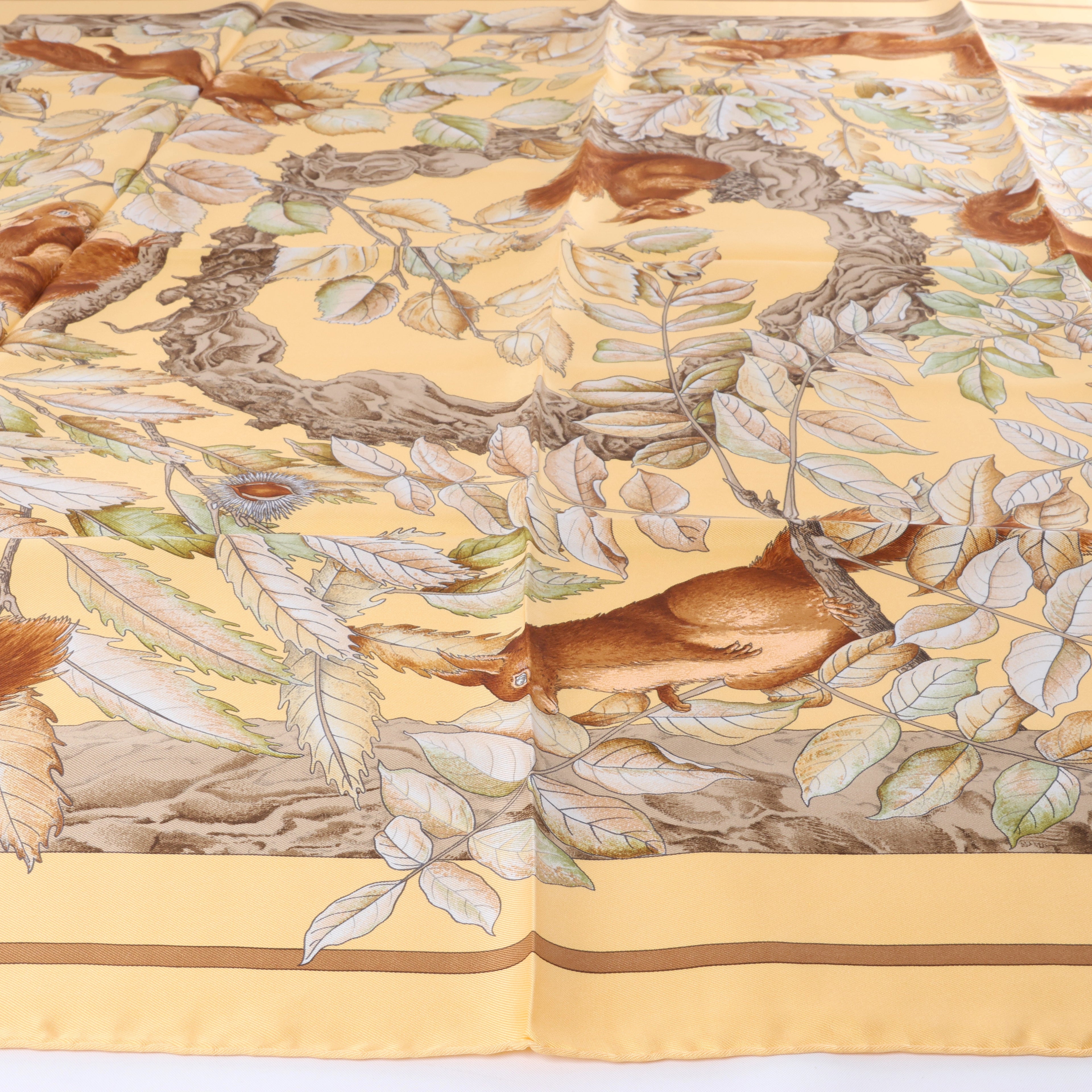Hermès Carré 90 "CASSE NOISETTE" Silk handkerchief in Yellow