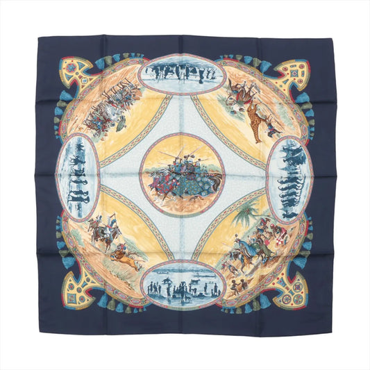 Hermès Carré 90 "CAVALIERS PEULS" silk handkerchief in navy blue featuring intricate illustrations of Peul horsemen, cultural scenes, and geometric patterns with a circular central motif, displayed flat against a white background.
