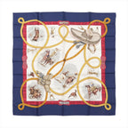 Hermès Carré 90 “Charreada” silk scarf with navy border, red frame, ivory center with rodeo rider scenes, and looping gold lariat motif.