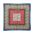 Blue Hermès Carré 90 silk scarf with red and ivory panels, intricate hunting scenes, animal motifs and ornate patterned borders.