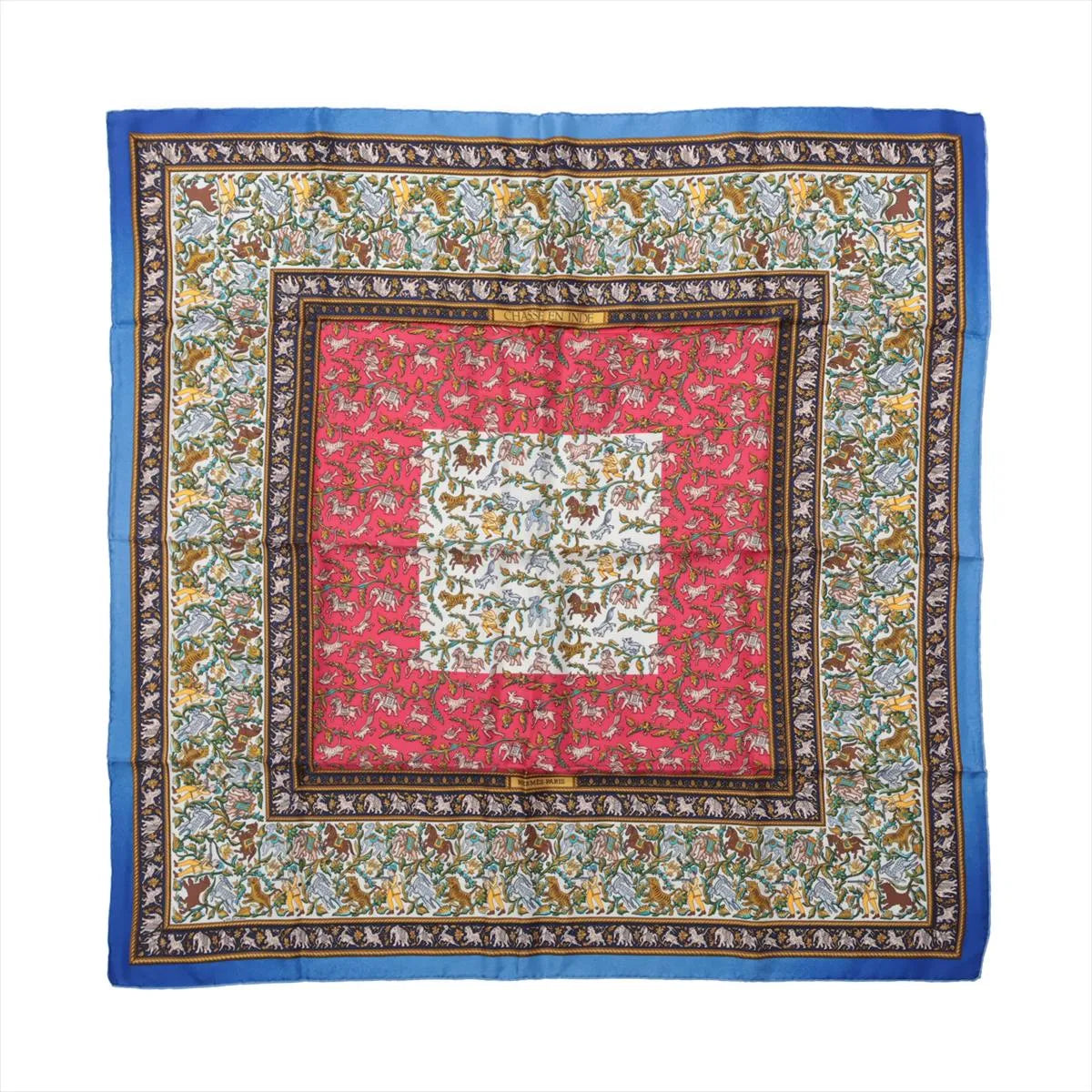 Blue Hermès Carré 90 silk scarf with red and ivory panels, intricate hunting scenes, animal motifs and ornate patterned borders.