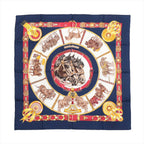 Hermès Carré 90 navy silk scarf with central horse head medallion, draft horse scenes, and red and gold belt-style border, laid flat