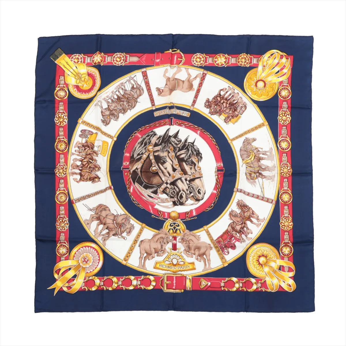 Hermès Carré 90 navy silk scarf with central horse head medallion, draft horse scenes, and red and gold belt-style border, laid flat
