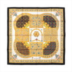 Hermès Carré 90 "Ciels Byzantins" silk scarf in black and gold featuring intricate Byzantine-style mosaic patterns, geometric motifs, and detailed archways bordered in rich gold and blue accents.