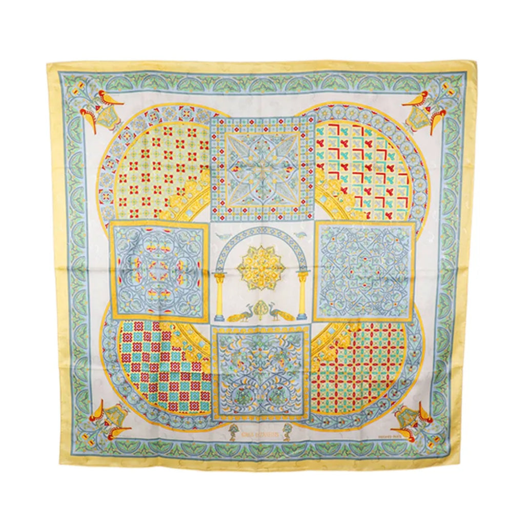 Hermès Carré 90 yellow, pale blue and ivory silk scarf with Byzantine-inspired mosaic panels, arches, birds and ornate geometric borders.