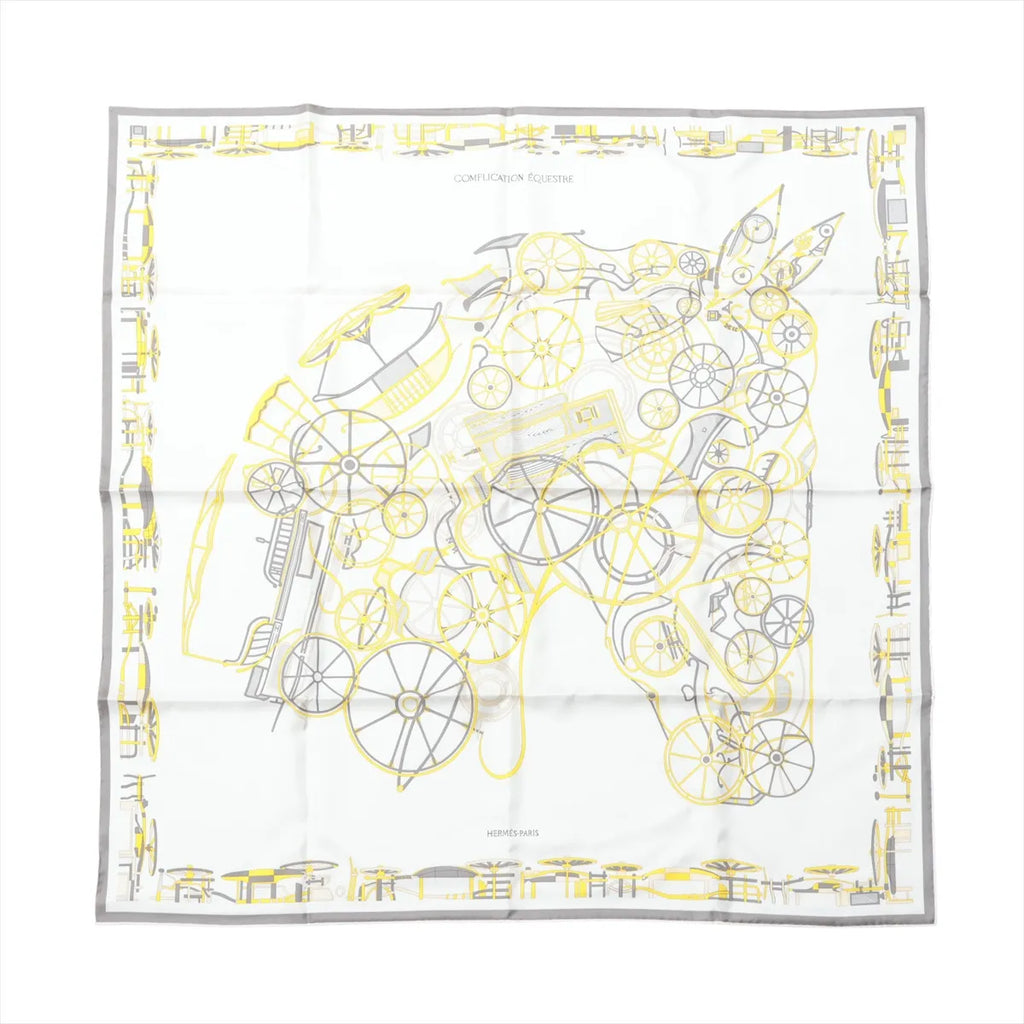 Hermès Carré 90 silk scarf in gray and yellow with white background, line-art horse made of wheel and harness motifs, and a gray border with yellow accents.