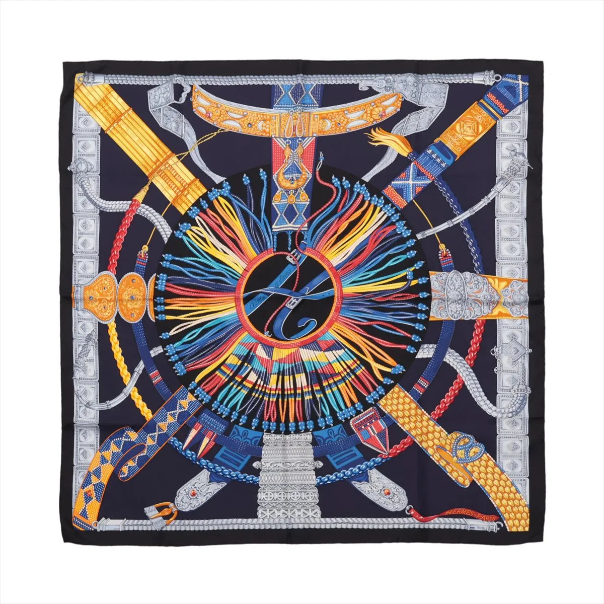 Hermès Carré 90 "Ceintures et Liens" silk scarf in navy blue featuring an intricate central circular design composed of multicolored belts, cords, and ornamental buckles radiating outward with metallic silver, gold, red, blue, and yellow detailing.