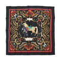 Hermès Carré 90 “Cheval Turc” silk scarf in black with red border, ornate gold scrollwork frame, and central horse and figure illustration.