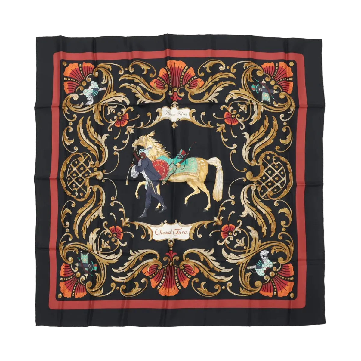 Hermès Carré 90 “Cheval Turc” silk scarf in black with red border, ornate gold scrollwork frame, and central horse and figure illustration.
