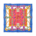 Hermès Carré 90 silk scarf in blue with red center panel, featuring gold harness and buckle motifs, teal straps, and purple ribbon flowers.
