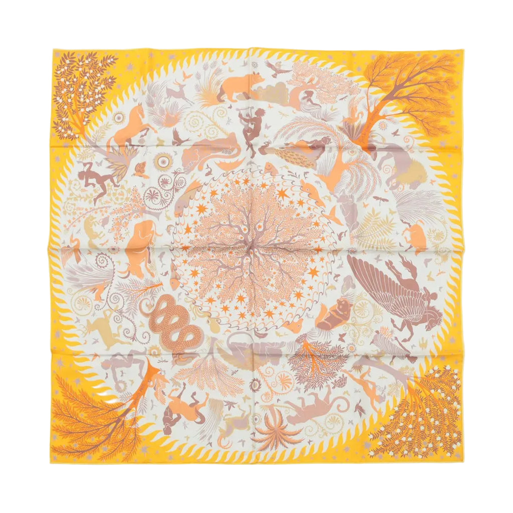 Yellow Hermès Carré 90 double-face silk scarf laid flat with intricate animal and botanical motifs, central circular tree and star design, and yellow border on white background.