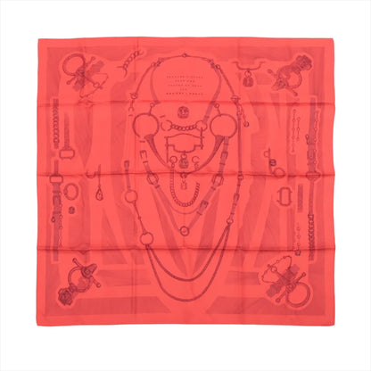 Hermès Carré 90 "Étvde Povr Vne Parvre de Gala" silk scarf in red, featuring intricate tonal illustrations of bridles, bits, and equestrian chains arranged symmetrically over a subtle background monogram.